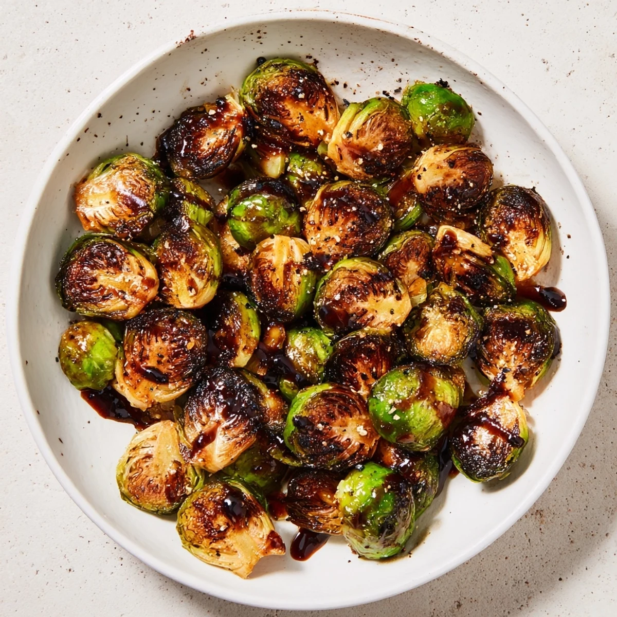 Sizzling Roasted Brussels Sprouts with Balsamic Glaze served hot from the oven, bursting with tangy-sweet aroma.