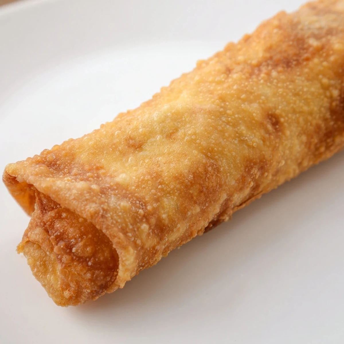 Plate of homemade Southwest egg rolls featuring a colorful corn and pepper filling