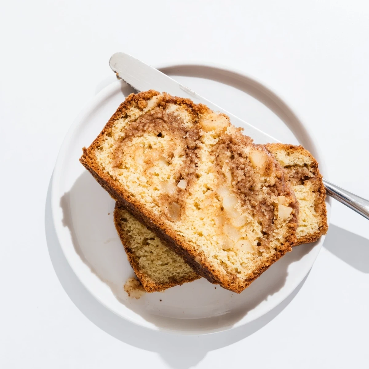 Warm cinnamon apple bread freshly baked showing marbled cinnamon sugar swirl throughout the crumb