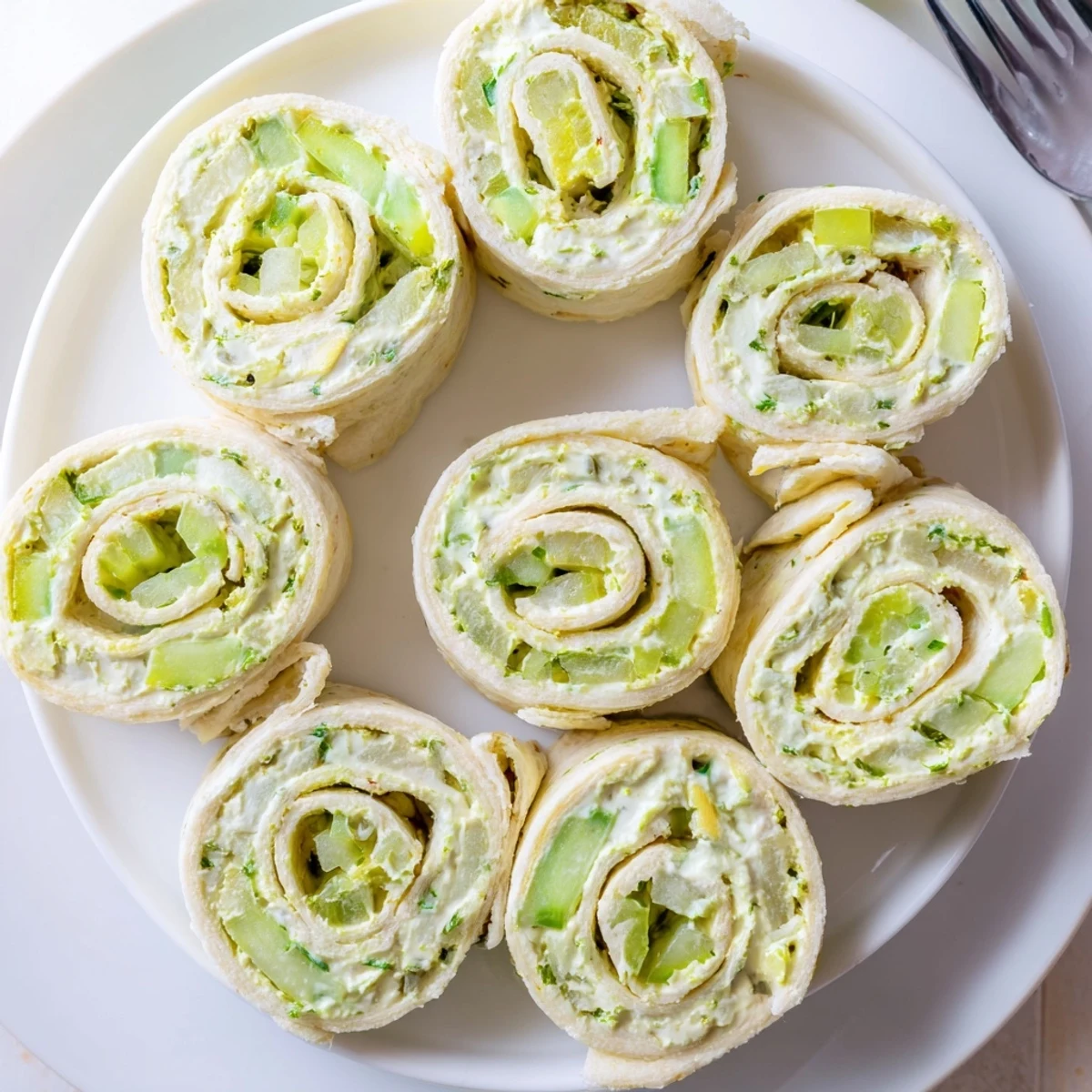 Pickle Dip Pinwheels arranged on platter, creamy dill filling, chilled bite-sized snacks