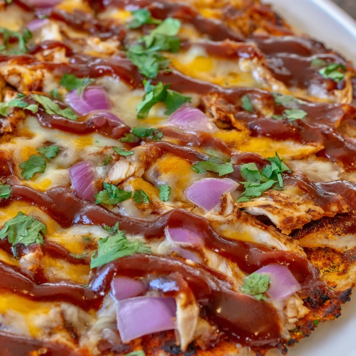 Golden grilled BBQ chicken pizza loaded with melted cheese and fresh cilantro