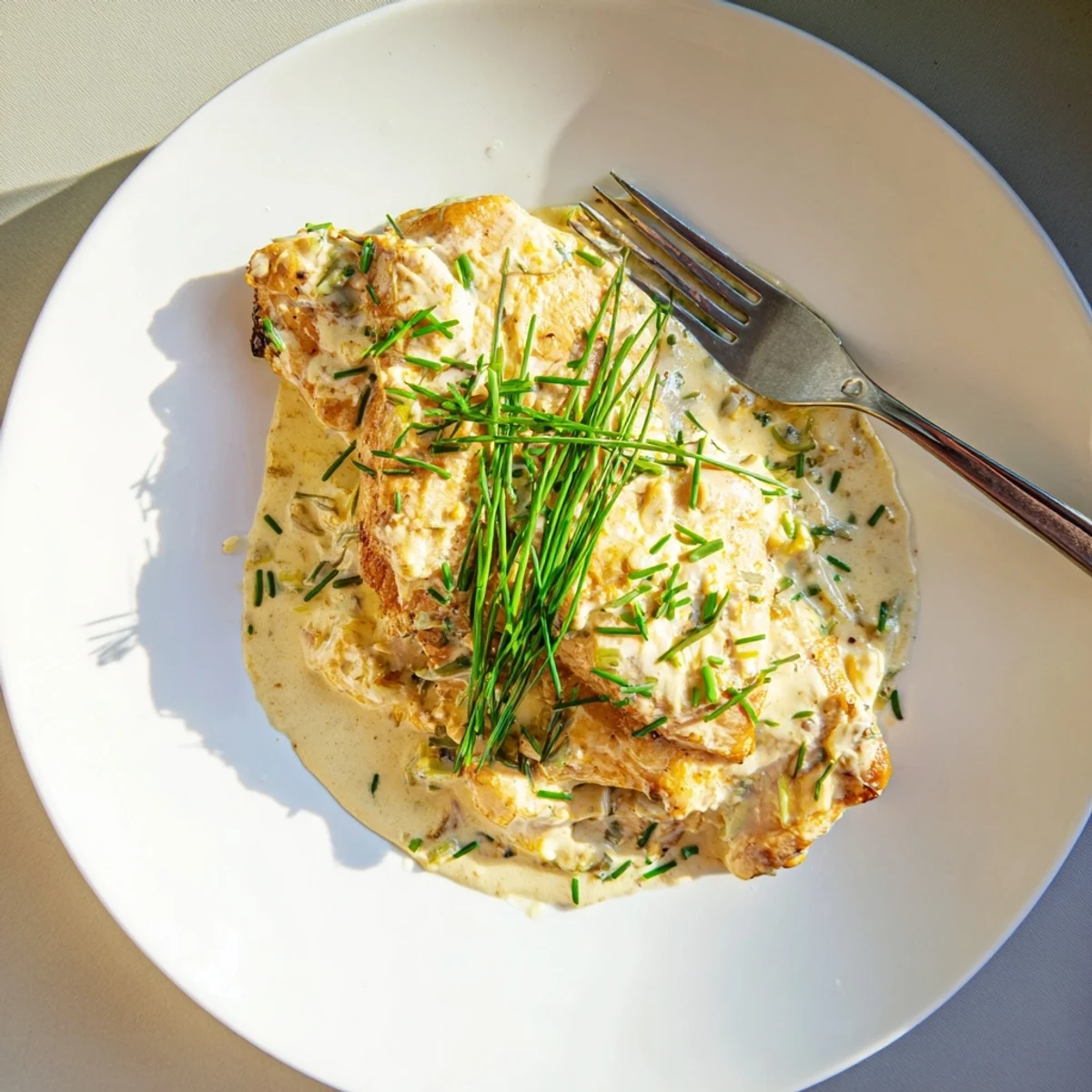 Cream cheese chicken nestled in a rich garlic sauce ready for a comforting dinner