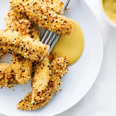 Homemade honey mustard chicken tenders recipe featuring juicy fried strips with sweet honey mustard drizzle